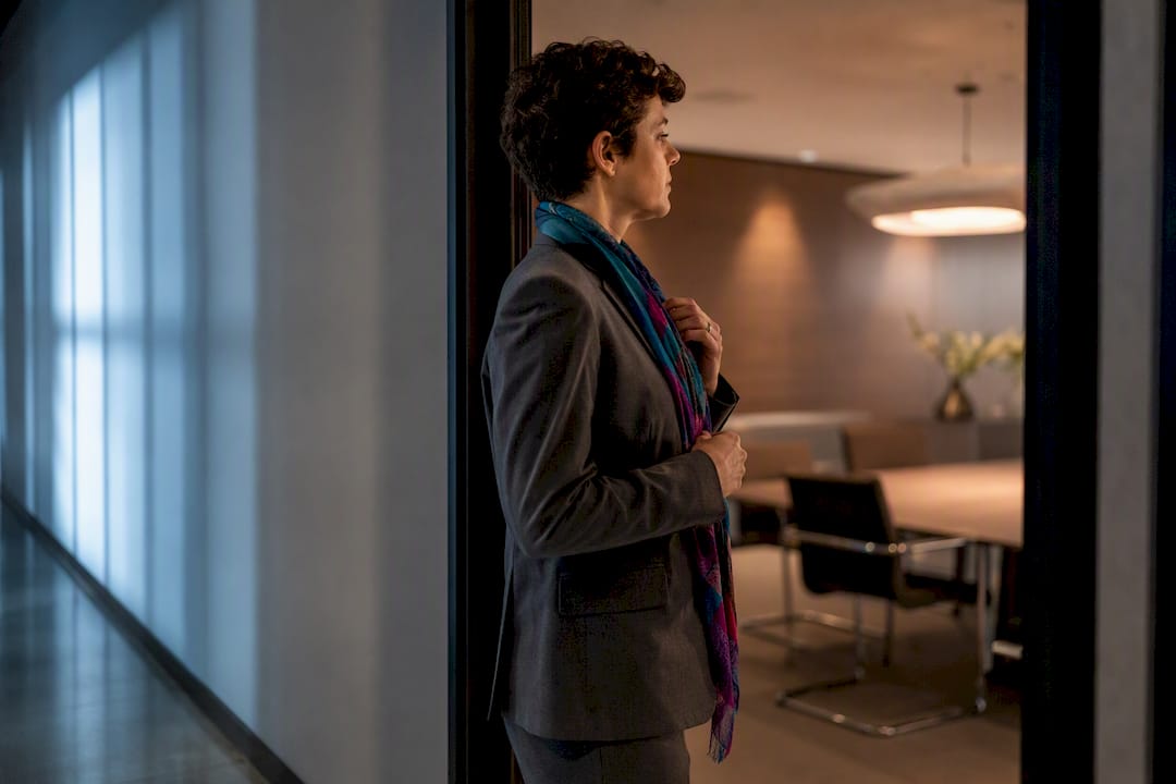 Adult preparing to mask before meeting