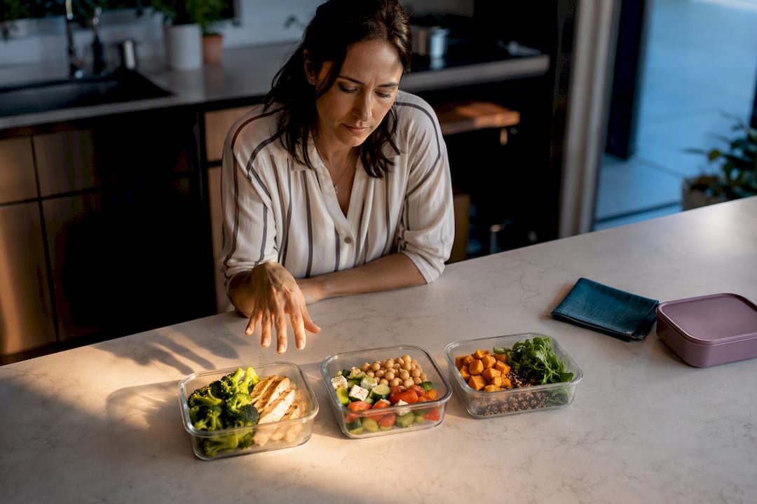 Adult hesitating between prepared lunch options